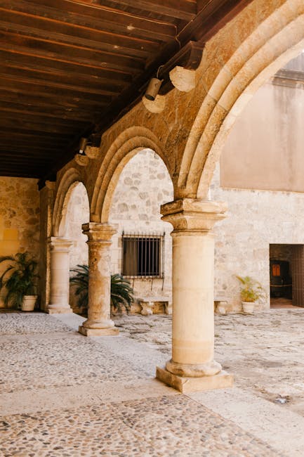 Elegant stone archway showcasing classic colonial architecture in Santo Domingo's historic district.